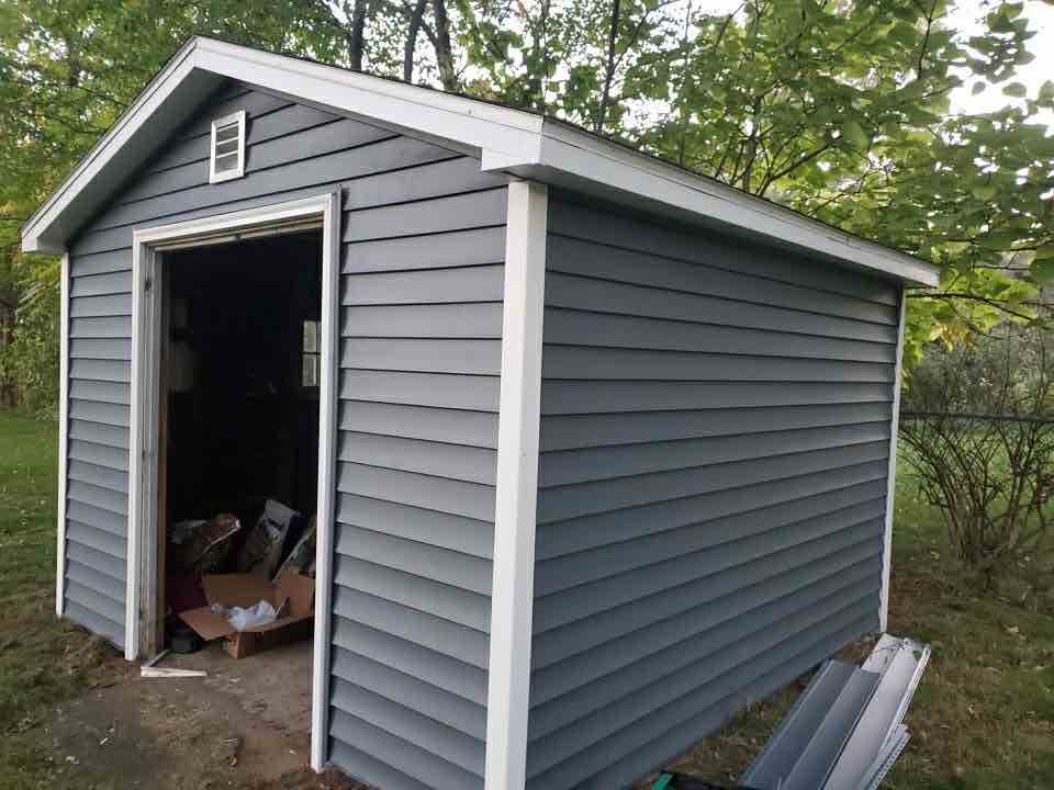 shed building with new siding and roofing project in holland mi